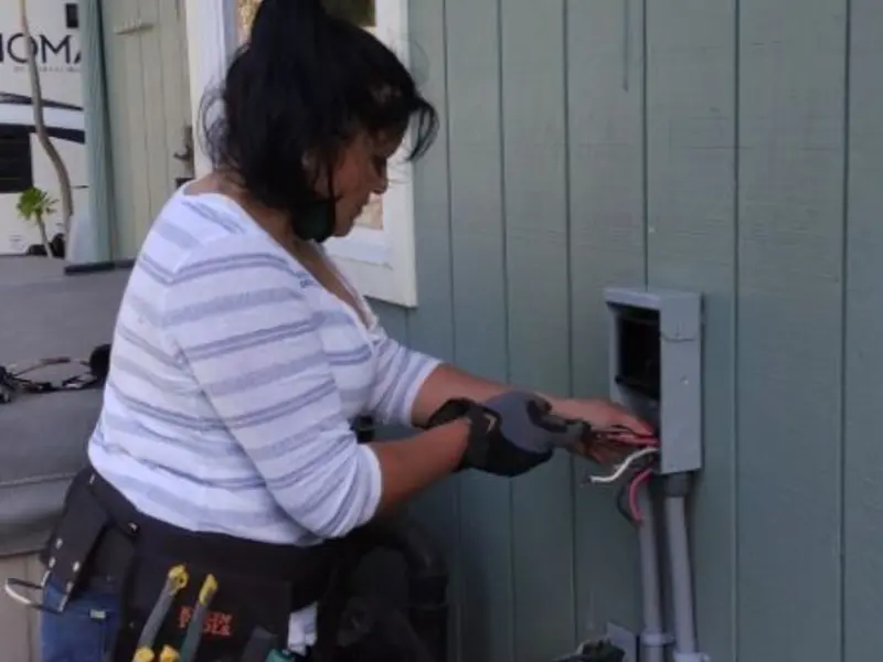 Licensed electrician wiring an exterior subpanel in Centerville